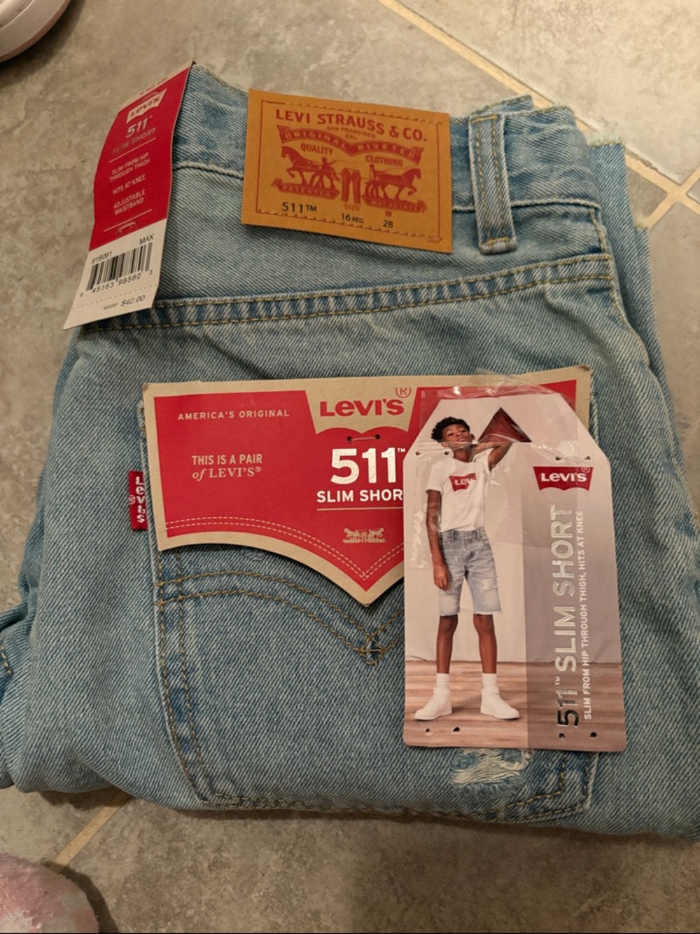 Levi's light blue denim 511 slim shorts with red accents
